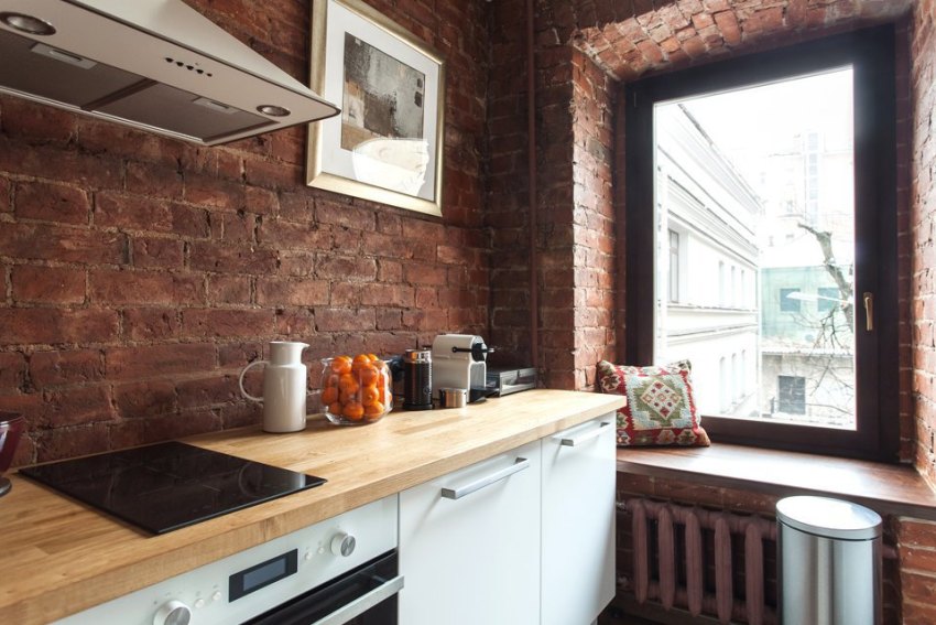 La cocina del apartamento está decorada en estilo loft. La cocina del apartamento está decorada en estilo loft.