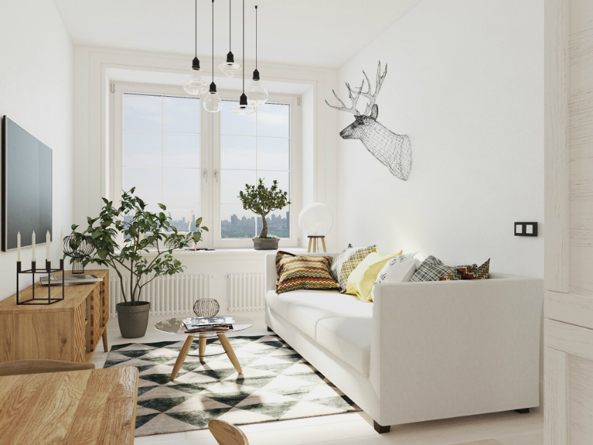 The interior, decorated in a monochromatic white color scheme, looks very cozy due to the decor and indoor plants The interior, decorated in a monochromatic white color scheme, looks very cozy due to the decor and indoor plants